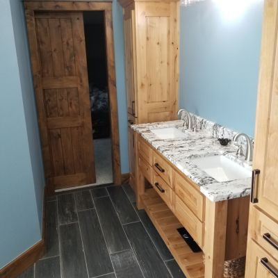 bathroom remodel with countertops and tile floors